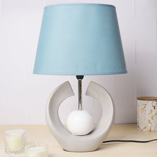 ceramic table lamp with textured base and linen shade, illuminating warmth and elegance
