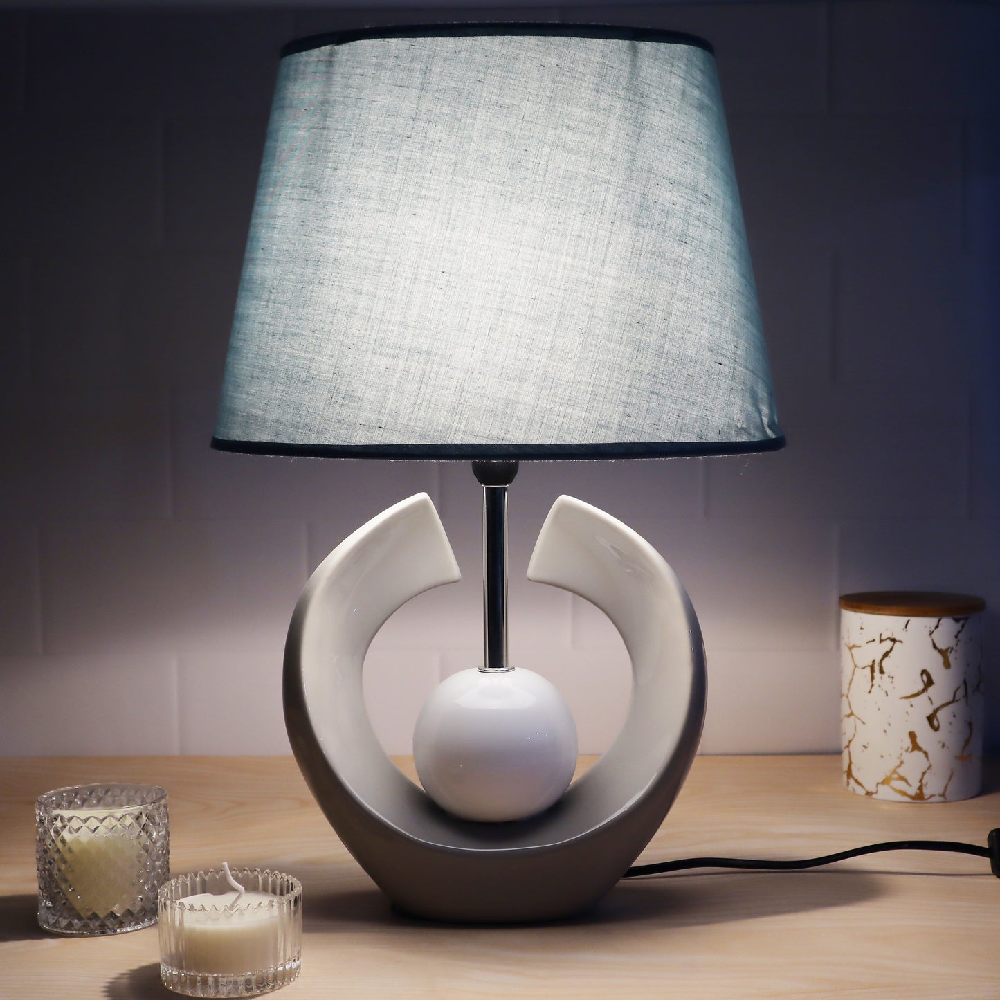 ceramic table lamp with textured base and linen shade, illuminating warmth and elegance