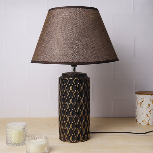 ceramic table lamp with textured base and linen shade, illuminating warmth and elegance