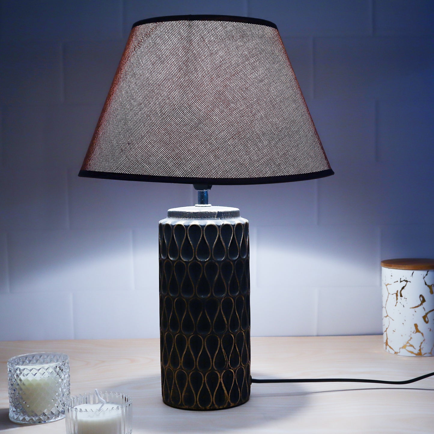 ceramic table lamp with textured base and linen shade, illuminating warmth and elegance