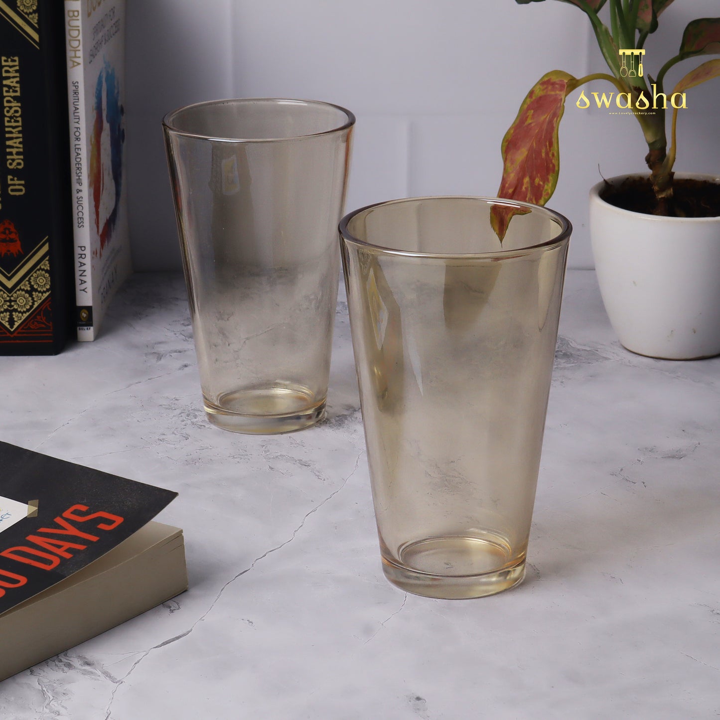 Set of 4 versatile glass tumblers - perfect for refreshing juices and water.