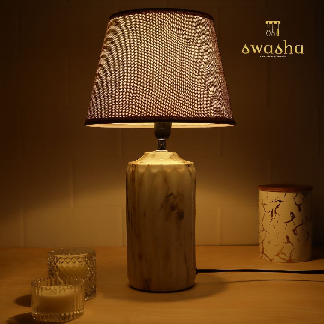 ceramic table lamp with textured base and linen shade, illuminating warmth and elegance