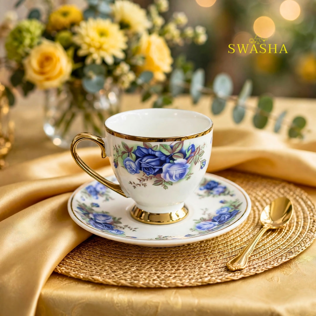 Swasha royal blue floral cup saucer set of 6 blue rose print with gold rim and gold foot on golden table mat with spoon