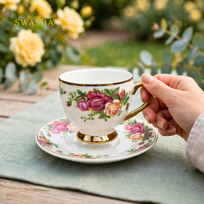 Swasha vintage floral cup saucer set of 6 english rose print with gold rim and gold foot on green table
