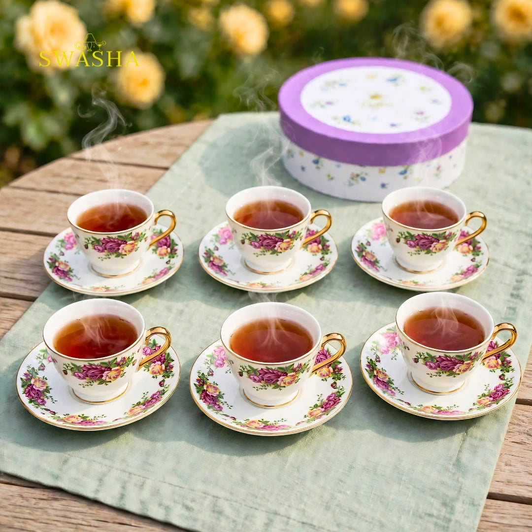 Swasha vintage floral cup saucer set of 6 english rose print with gold rim and gold foot on green table