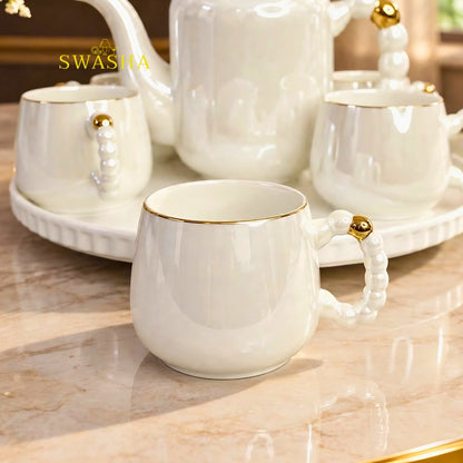 Swasha pearl 8 pcs revolving tea set white ceramic kettle with 6 cups pearl handle gold rim and revolving tray with purple gift bag
