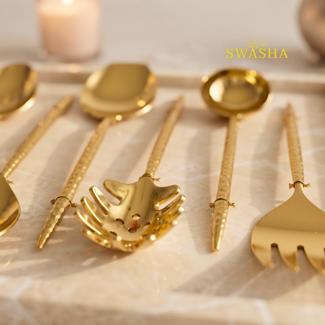 luxury gold plated brass serving spoons and ladles closeup