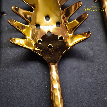 luxury gold plated brass serving spoons and ladles closeup