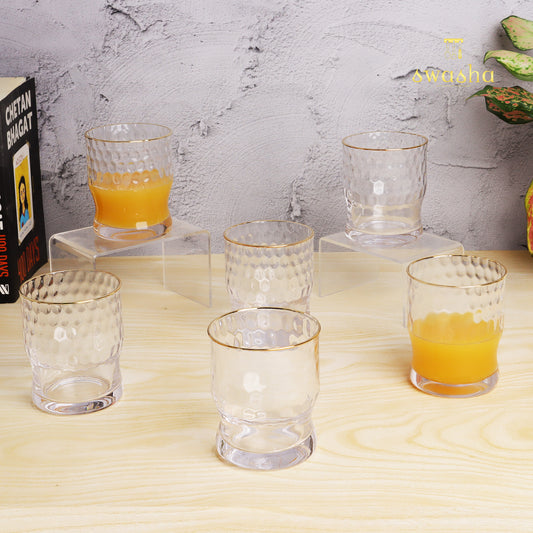 Set of 6 versatile glass tumblers - perfect for refreshing juices and water.