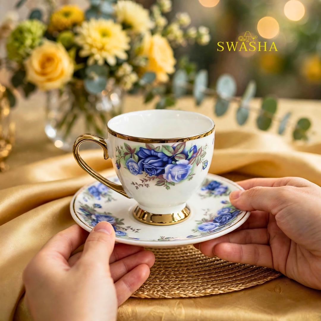 Swasha royal blue floral cup saucer set of 6 blue rose print with gold rim and gold foot on golden table mat with spoon