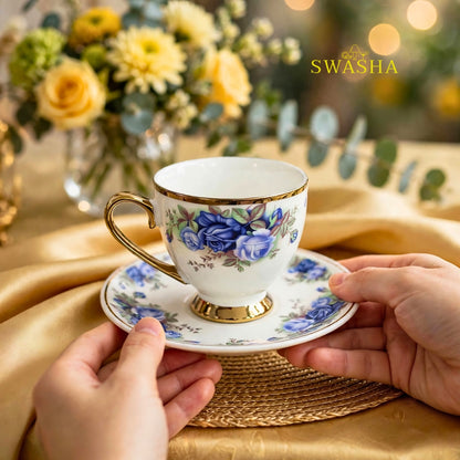 Swasha royal blue floral cup saucer set of 6 blue rose print with gold rim and gold foot on golden table mat with spoon