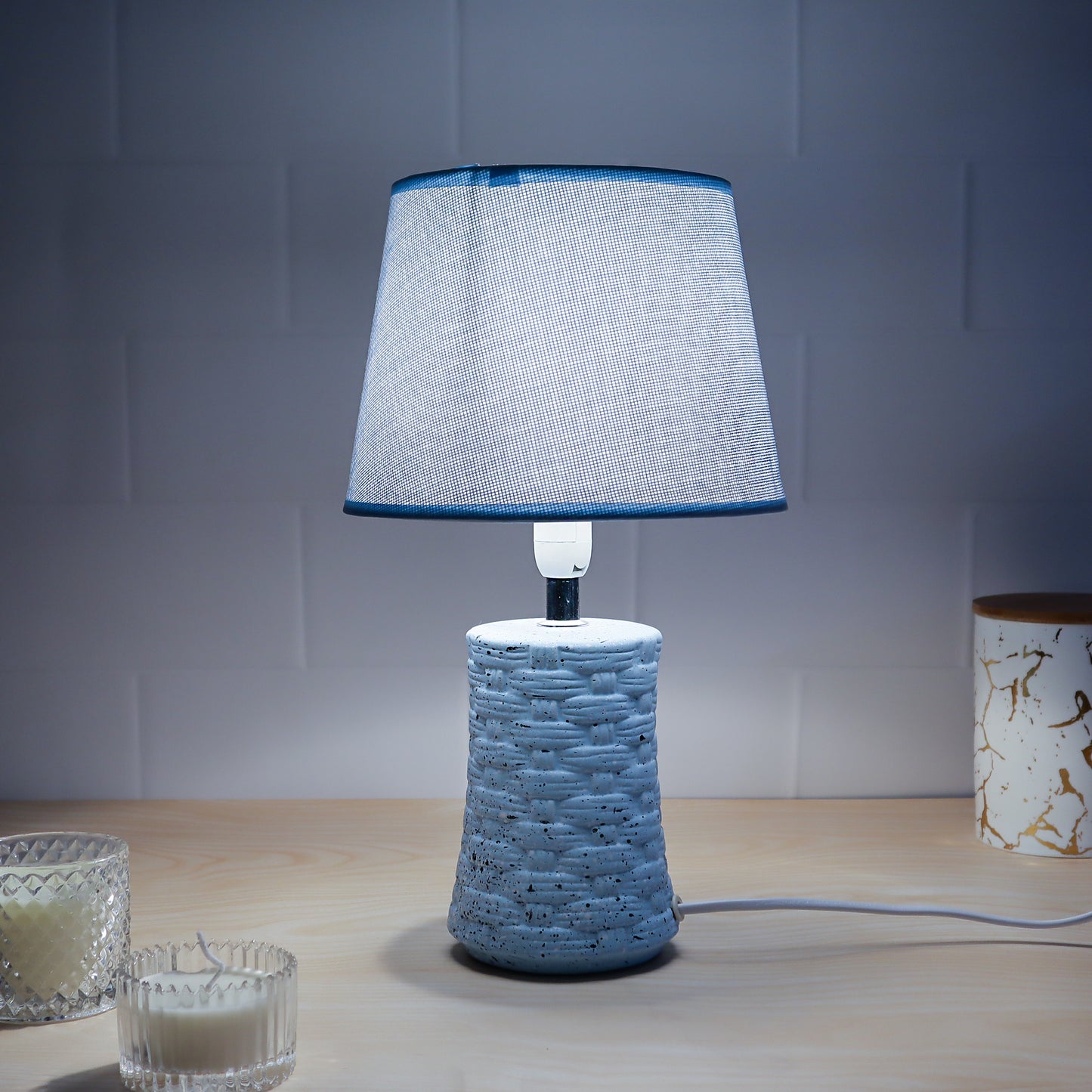 ceramic table lamp with textured base and neutral shade, adding warmth to any room décor