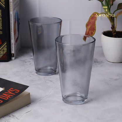 Set of 4 versatile glass tumblers - perfect for refreshing juices and water.