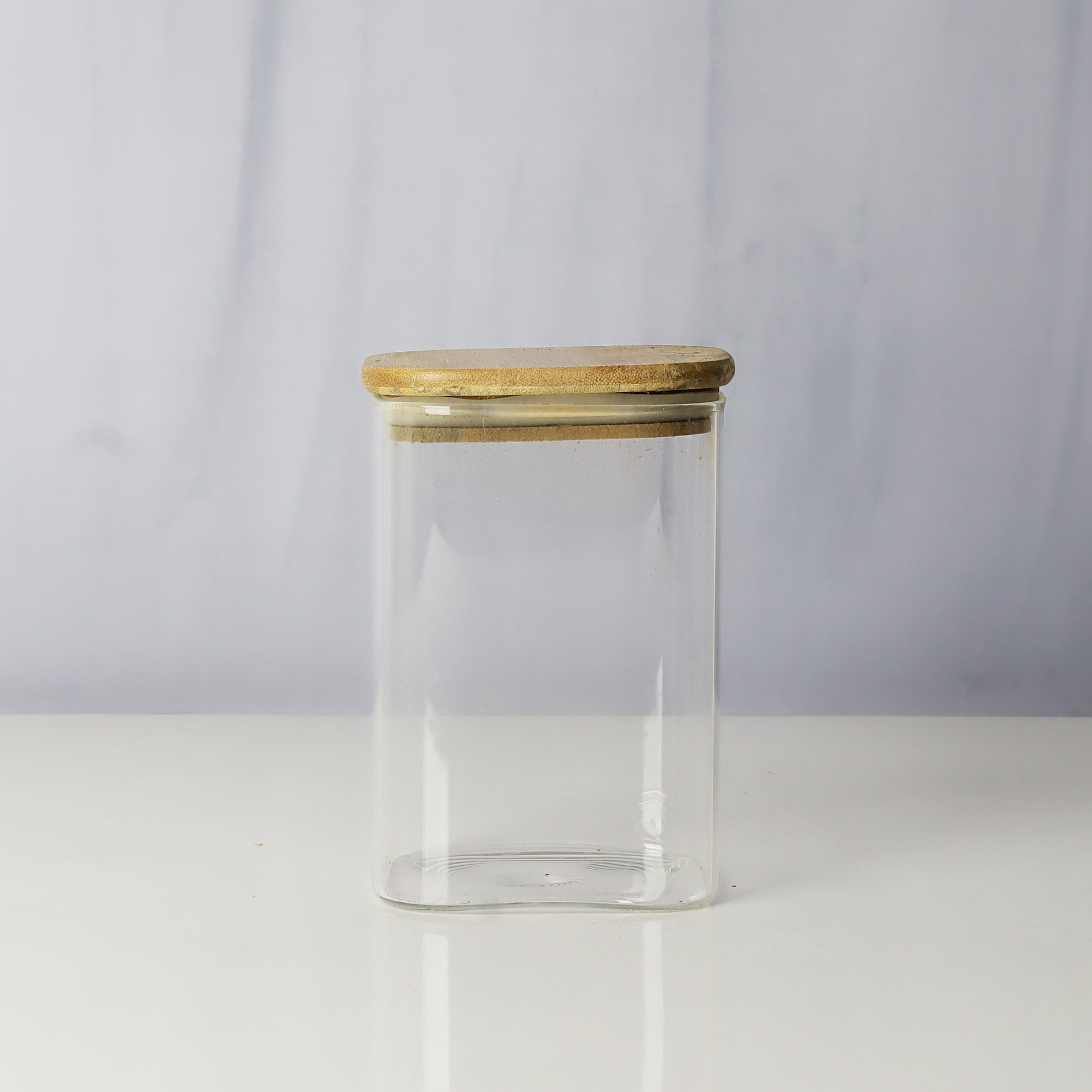 Glass jars/containers with stylish wooden lids - ideal for organized storage solutions