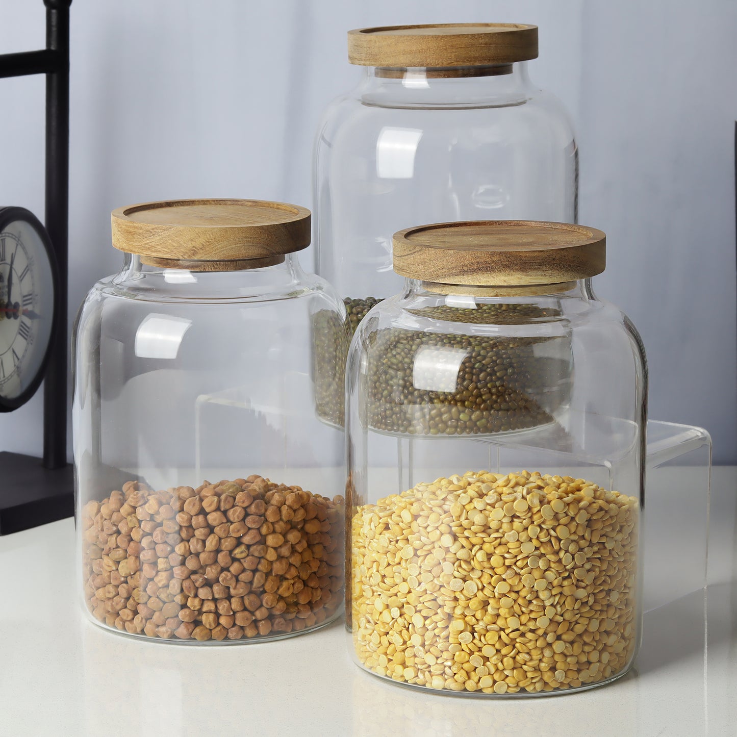 Glass jars/containers with stylish wooden lids - ideal for organized storage solutions