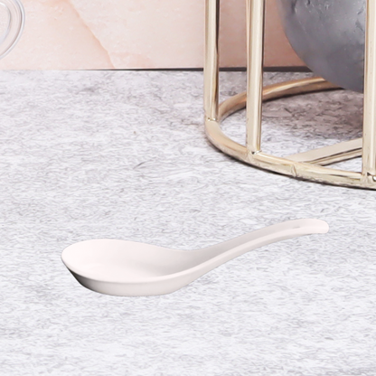 Polished ceramic spoon - a stylish and durable utensil for everyday use.