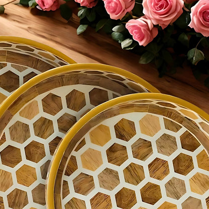 Wooden trays with hexagonal pattern on a wooden surface 